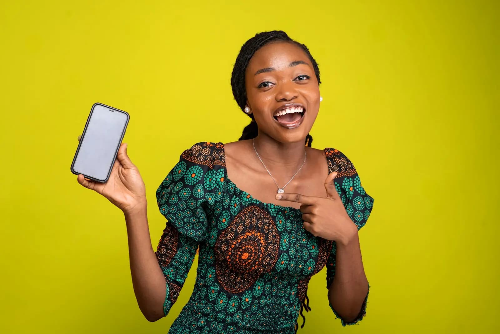 An employee holding up her phone