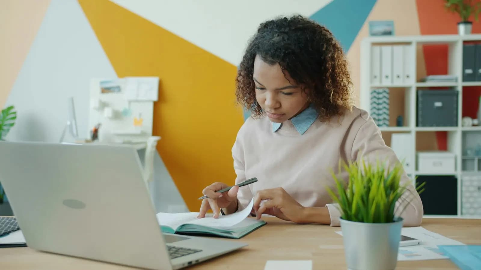 Someone working through paperwork at a desk